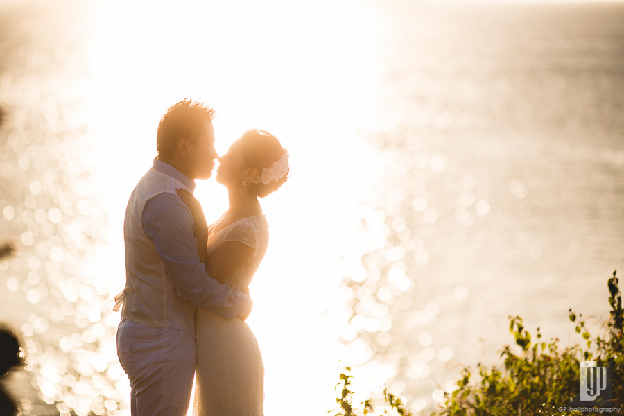 prewedding in tegal wangi beach bali smile happy sunset with love couple majestic beautiful cave and cliff