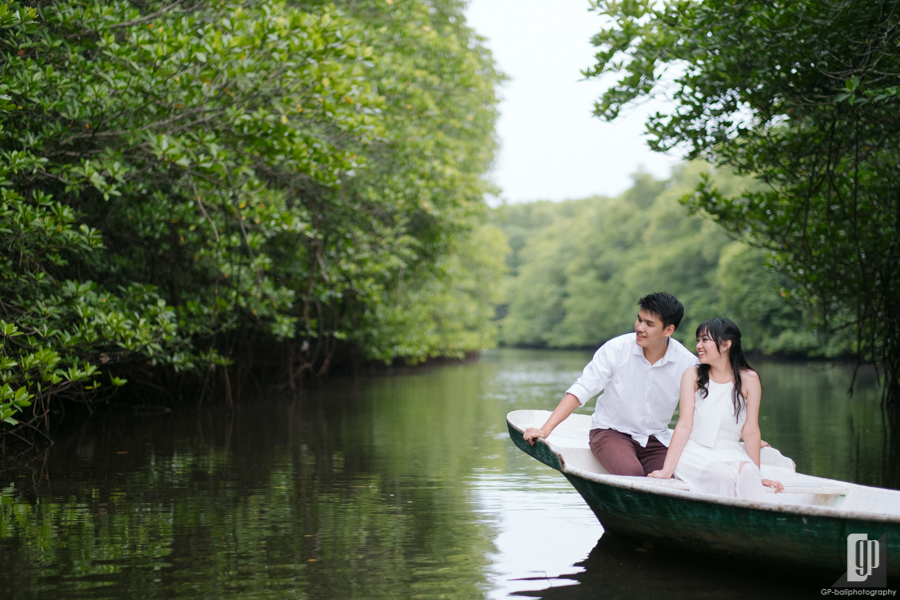 prewedding in mangrove forest in Lembongan Island Bali with love couple in the intimate sun light and blue sky