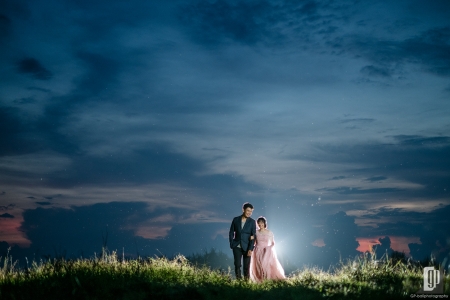 Prewedding in Dream Beach Lembongan Island Bali happy love smile pink gown and tuxedo sunset in the sky back light