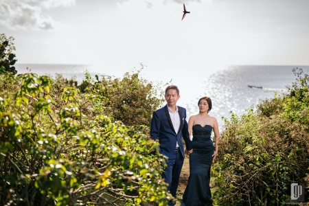 prewedding in tegal wangi beach bali love happy smile couple cave rock beach cliff blue sky