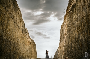 Prewedding in Melasti Beach Bali happy love smile happy sunset romantic hug kiss gray dress and tuxedo cliff