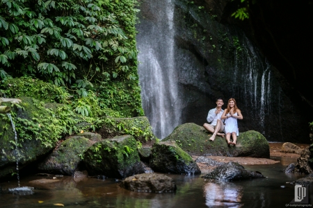 Prewedding in Waterfall Pengempu Bali happy love smile sun daylight with white dress and white shirt casual waterfall romantic