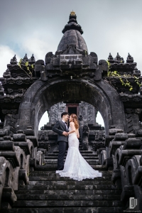 Prewedding in Taman Mumbul Nusa Dua Bali happy love smile happy cloudy romantic white dress and tuxedo kiss hug monument black stone