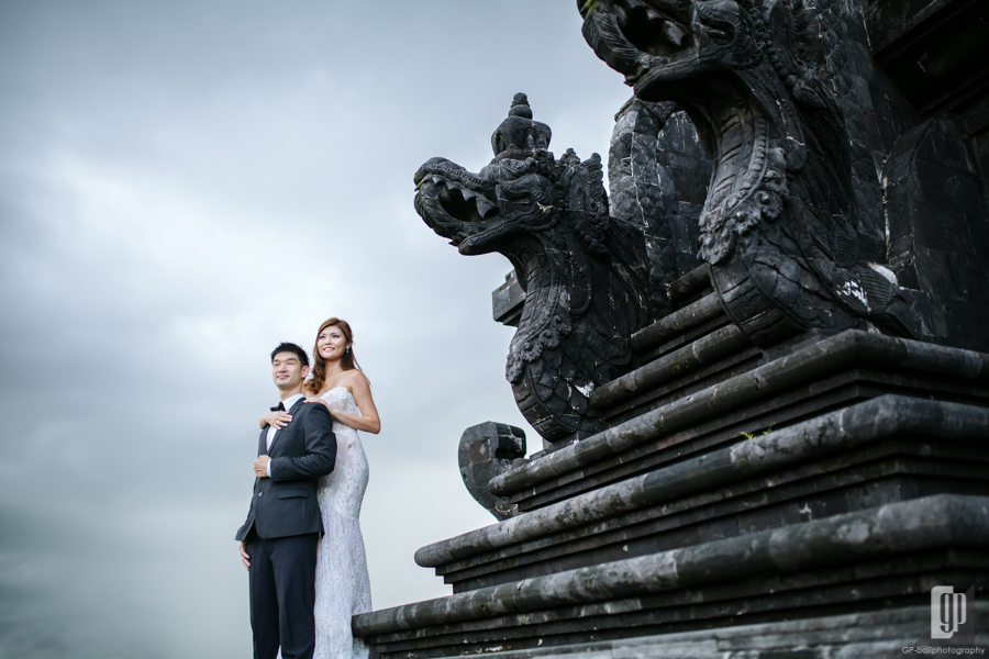 Prewedding in Taman Mumbul Nusa Dua Bali happy love smile happy cloudy romantic white dress and tuxedo monument