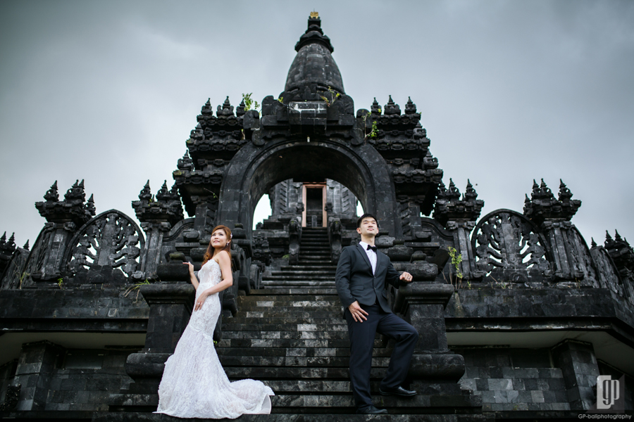 Prewedding in Taman Mumbul Nusa Dua Bali happy love smile happy cloudy romantic white dress and tuxedo monument